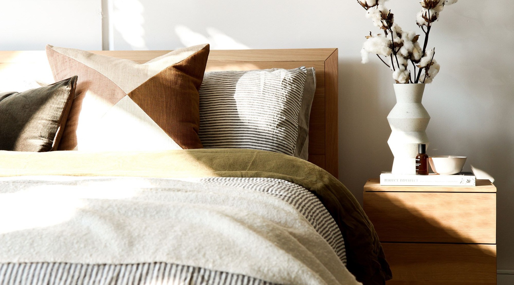 a bedroom with a bed and a nightstand